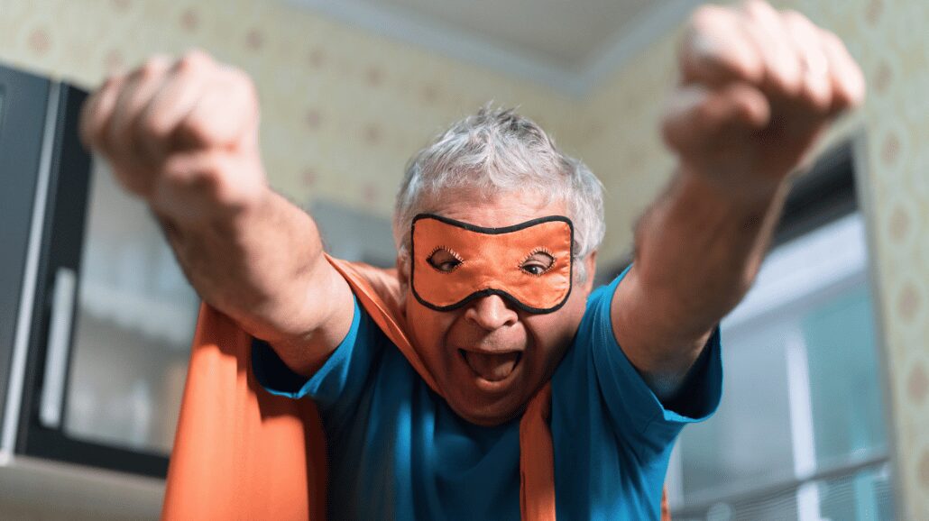 Senior man wearing DIY superhero costume