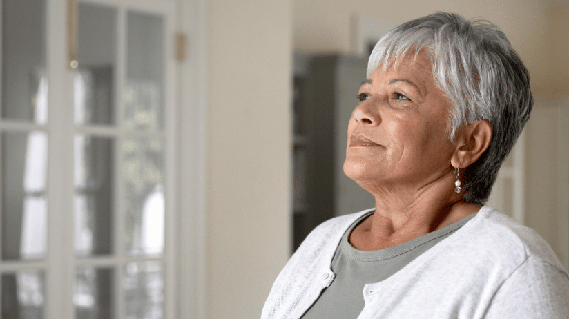 Hispanic senior woman taking a deep breath