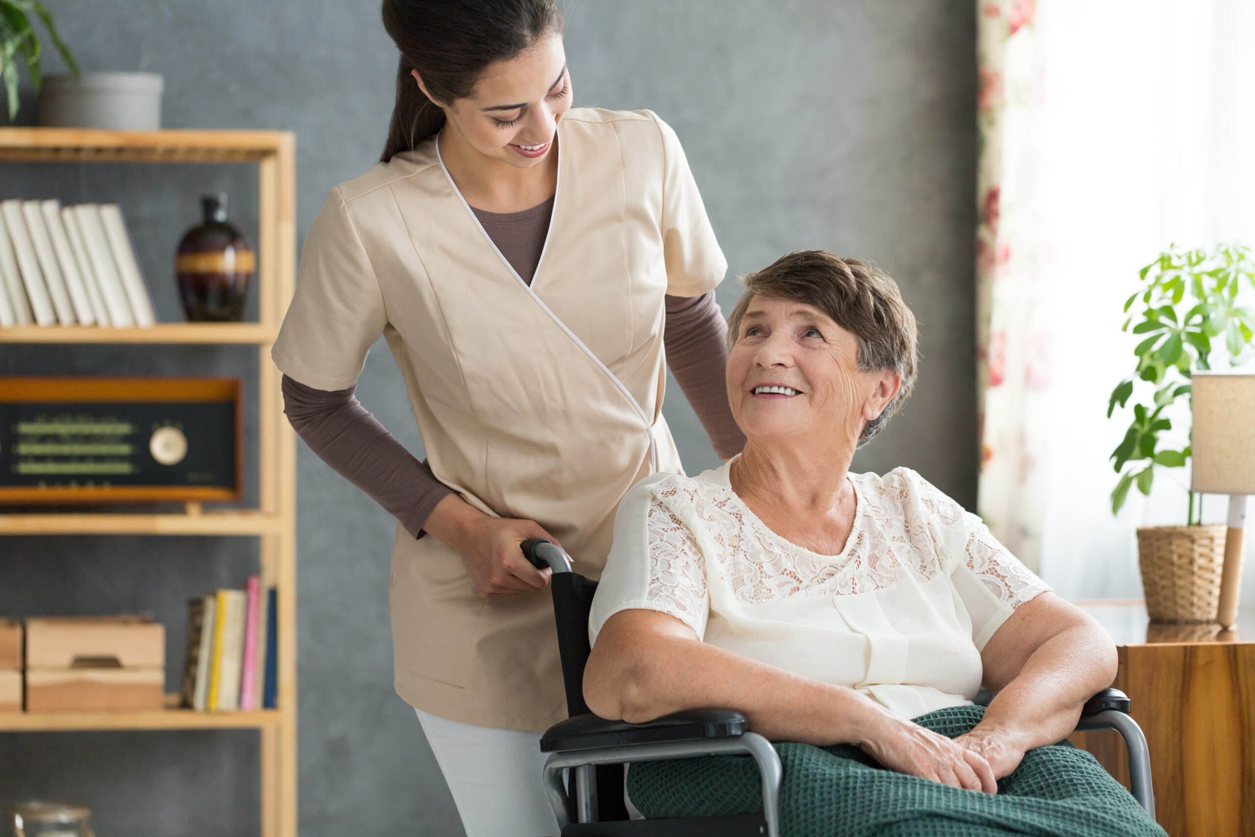 Caregiver in retirement home Concerned caregiver checking up on her elder patient