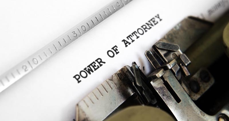 Typewriter with "power of attorney" on the paper