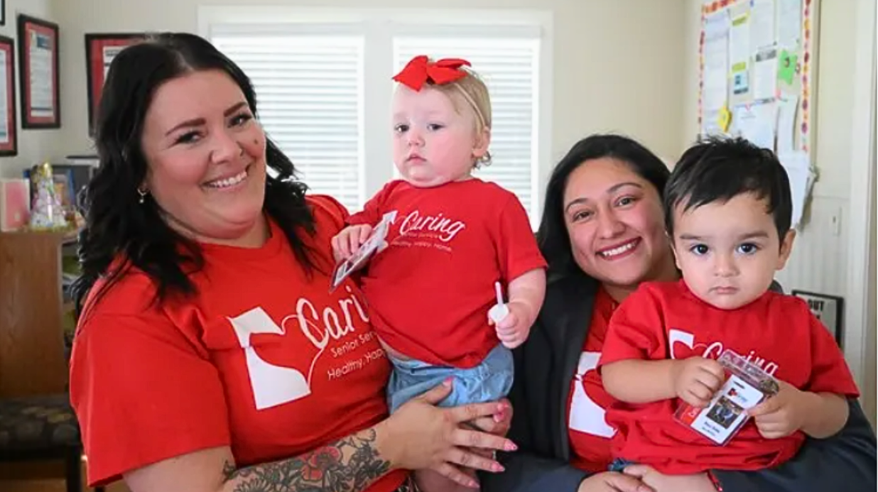 Staff of Caring Senior Service in Victoria, TX, and their young children