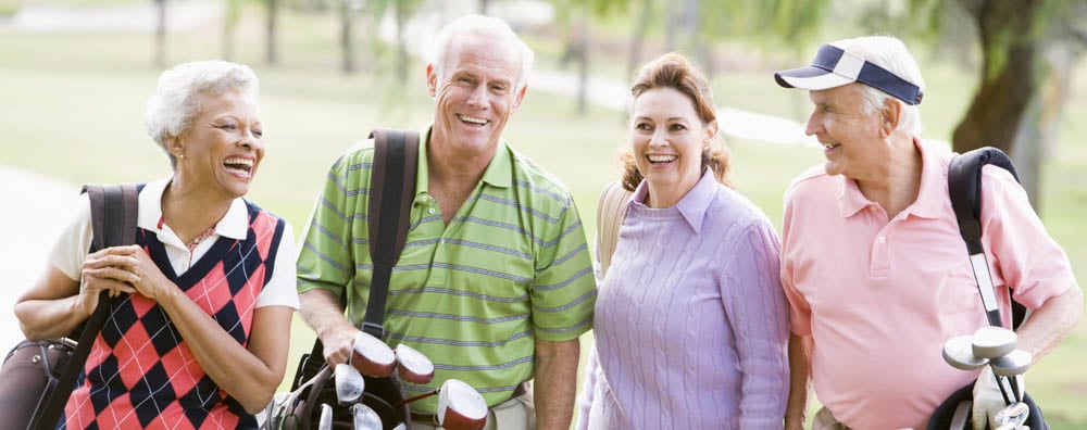 Group of seniors hanging out playing golf
